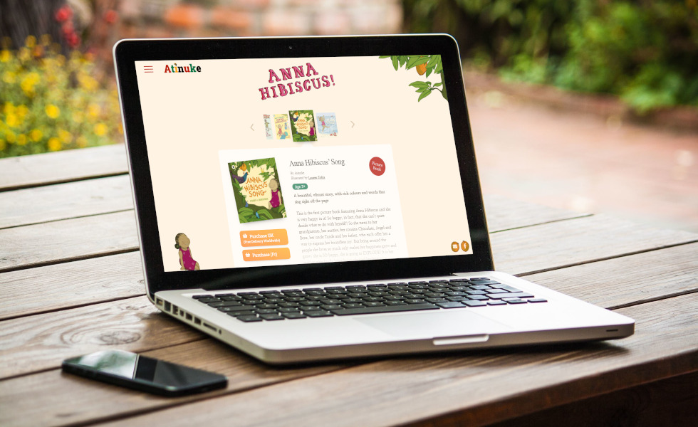Laptop displaying modern website design project on a wooden outdoor table in Wales, enhancing digital aesthetics