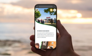 A Mobile phone with a screenshot of a website that Clickboom built